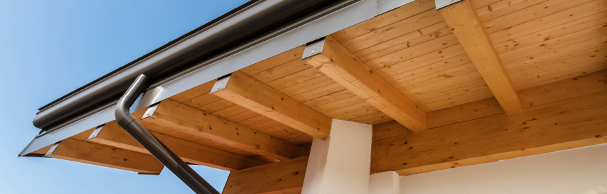 residential roof eaves with wood soffit and gutter system detail