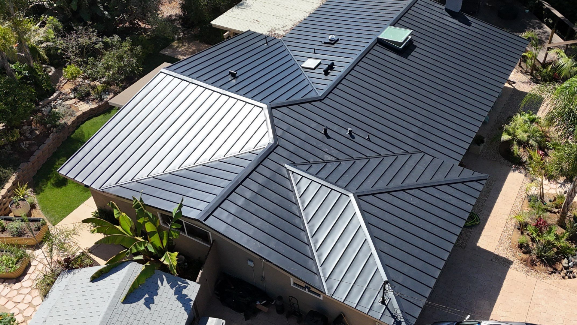 Standing seam metal roof on a residential home, ideal for solar panel installation due to its durability and compatibility with solar mounting systems.